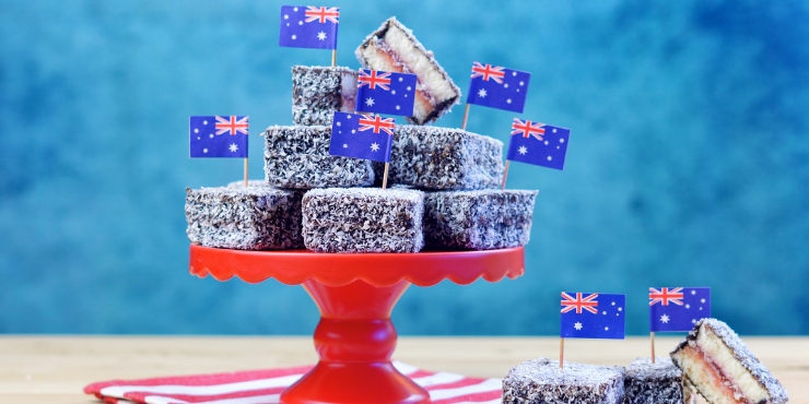 Lamingtons on a red stand with Australian flags.