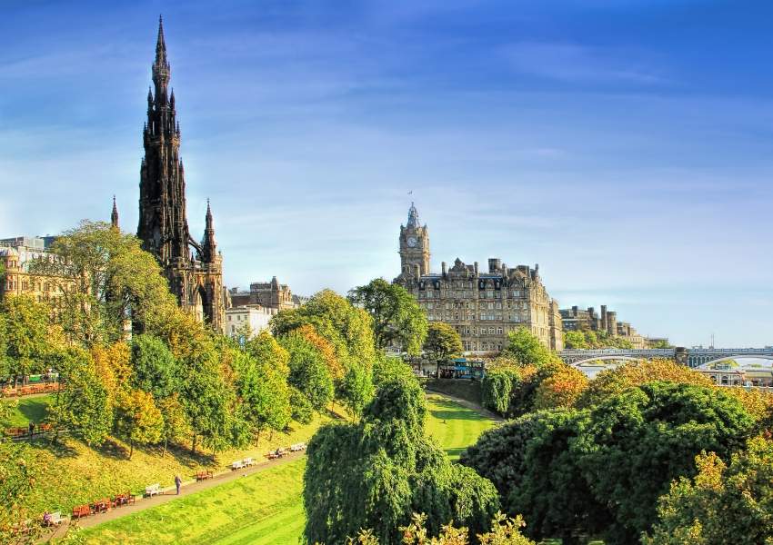 A view over a park in Edinburgh with the Scott memorial in the background