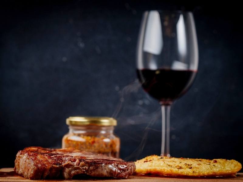 Argentinian steak and glass of red wine.