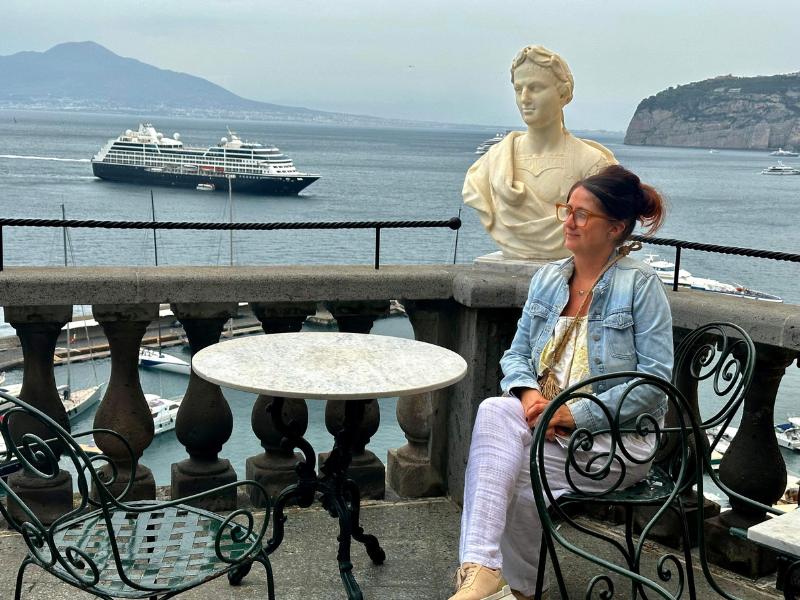 Episode 10 of the GTP Podcast guest Kylie Mitchell Smith sitting on a cruise ship.