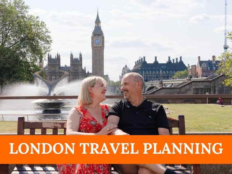 a man and woman sitting on a bench in front of a fountain