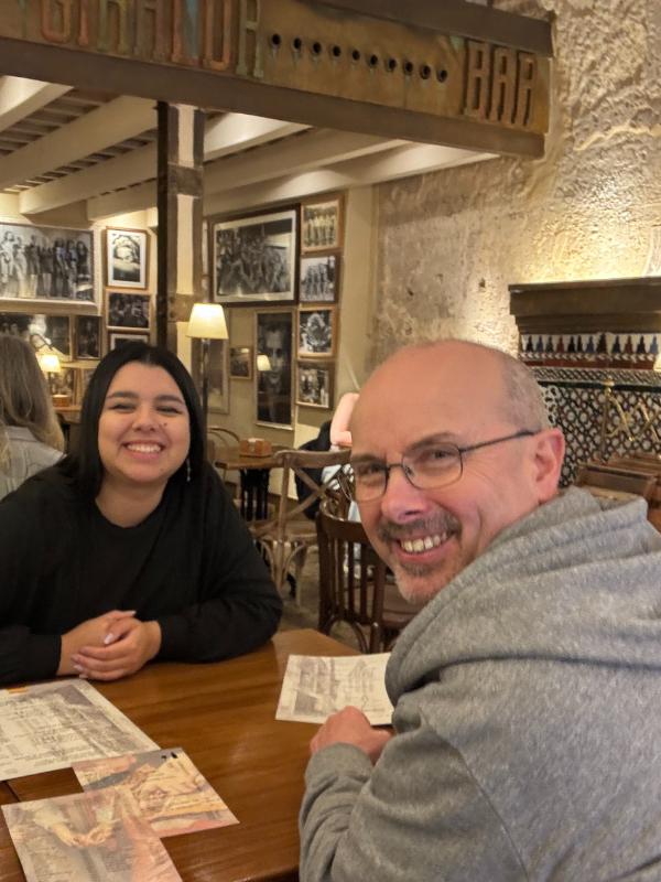 a man and woman smiling at the camera