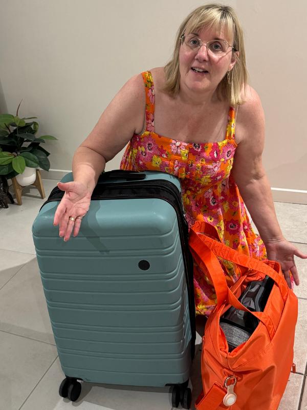 Tracy showing her packing for episode 47 of the podcast.