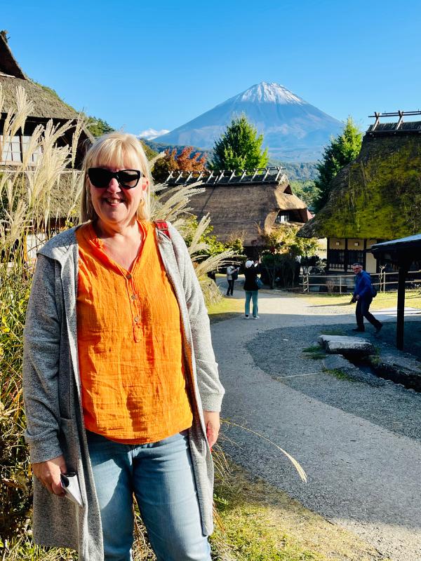 Lady standing in front of Mount Fuji.