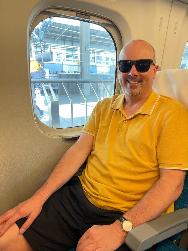 Doug on a train