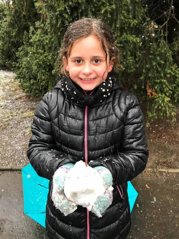 Myla with a snowball