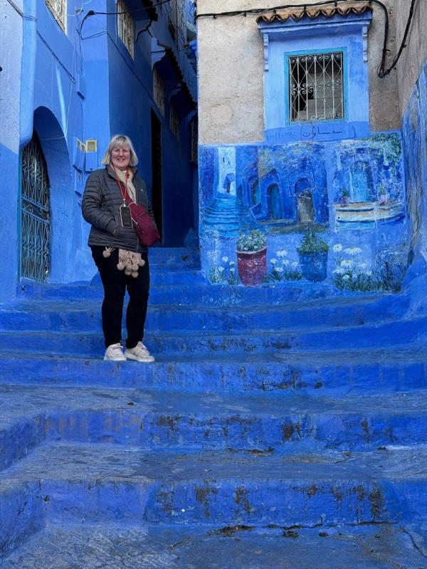 Tracy in Blue city on stairs trainers