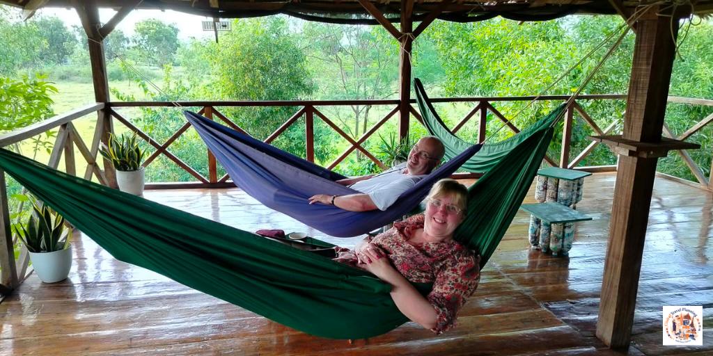 Tracy and Doug relaxing in a hammock at Moalboal Eco Lodge in Cebu, Philippines – Episode 92 Global Travel Planning Podcast.