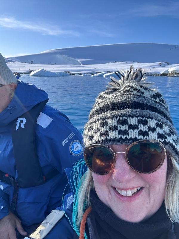 Tracy wrapped up warm on a zodiac during an Antarctica landing